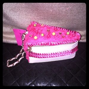 A brand new Betsy Johnson “cake” handbag.